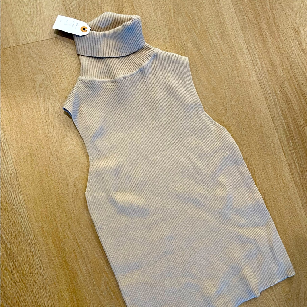 Sleeveless, tan sweater. Size small